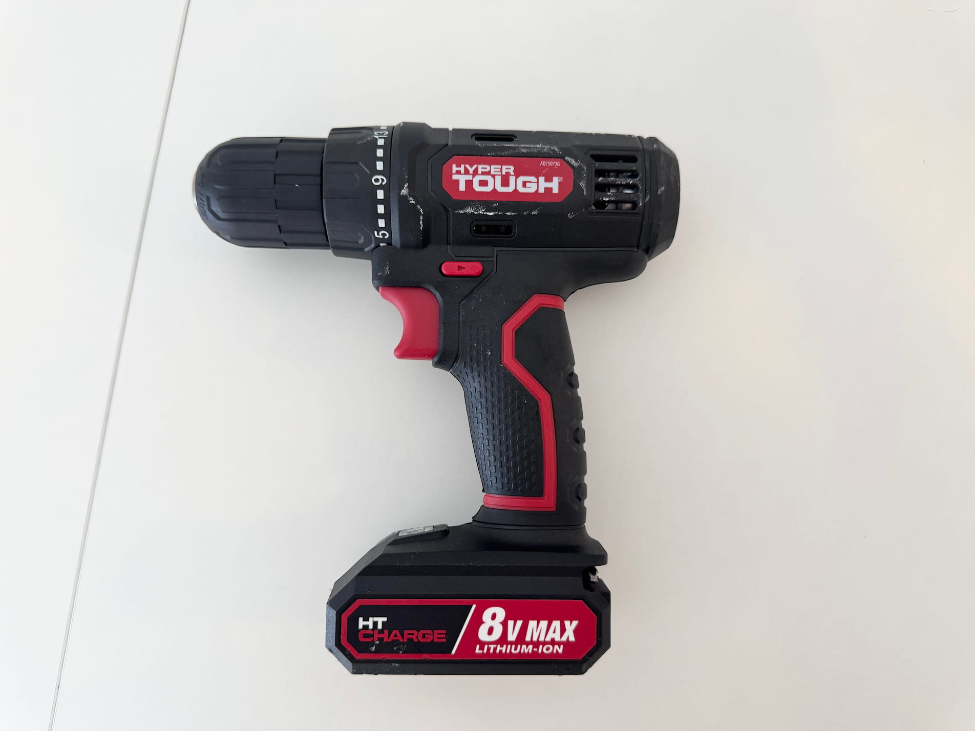 The sound of an electric screwdriver turning on