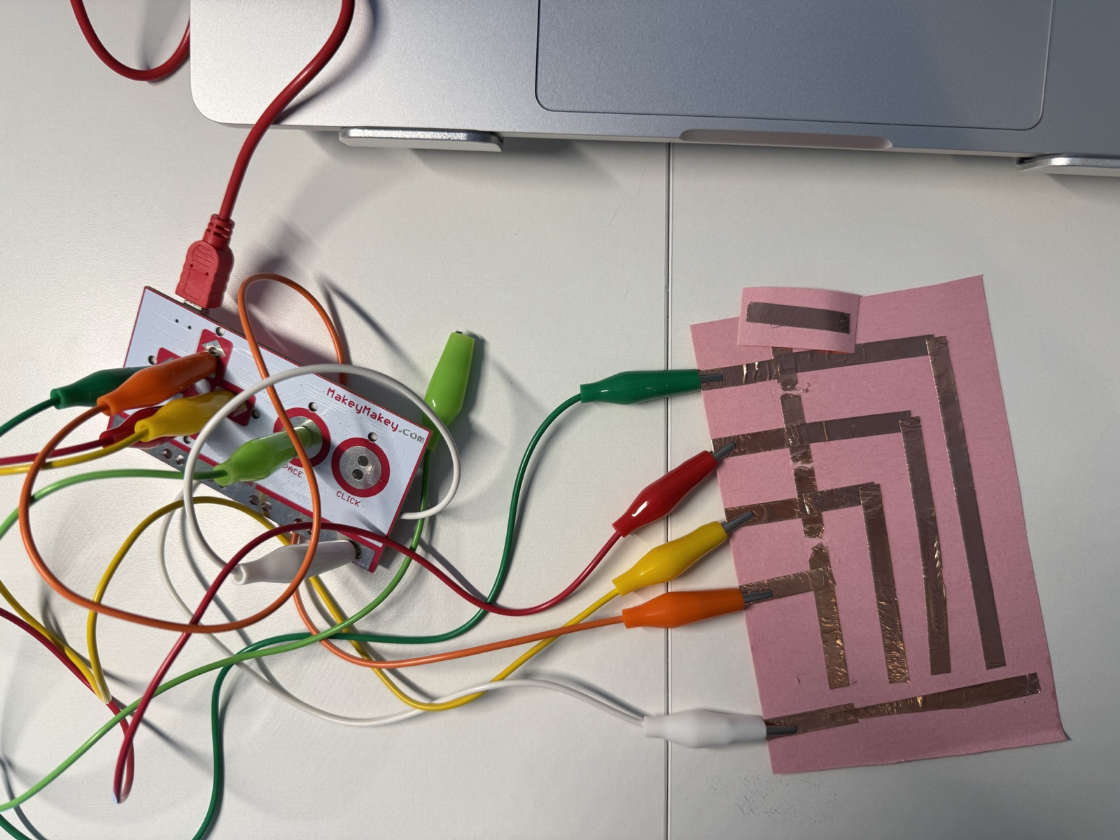 This was one of my first conductive tape layouts. I wanted to see how a flat paper interface could work as an input surface.
