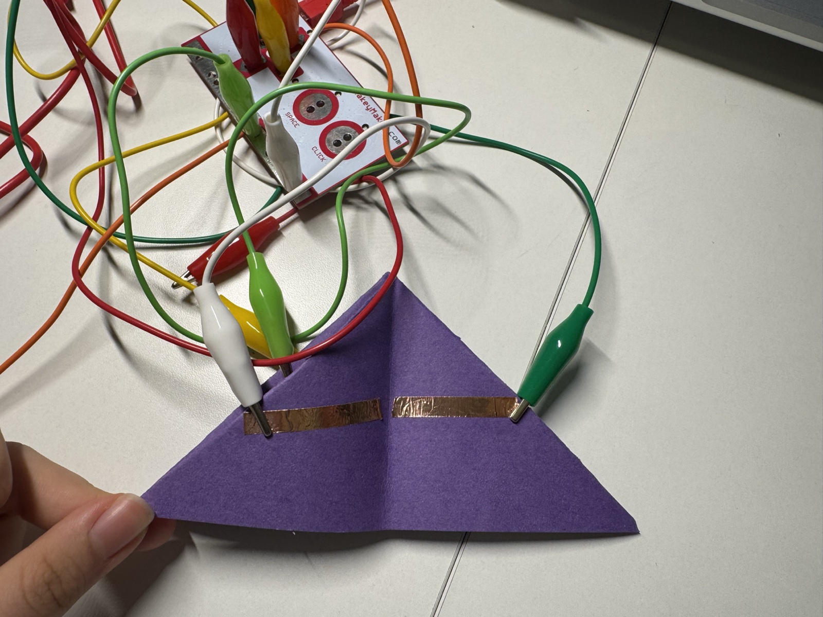 I folded the paper into a raised shape and added conductive tape to see if the interface could become more physical.