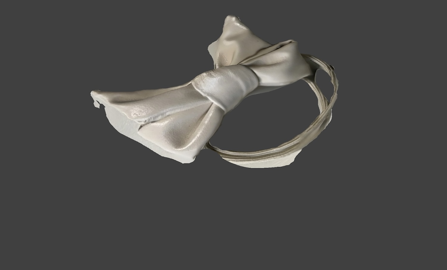 Side view of the hair tie. I scanned a hair tie with a bow, which I chose because it symbolizes my identity of being a female.