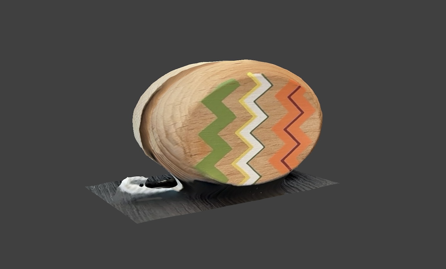 Side view of the yoyo. I chose a wooden yoyo because it was one of my favorite toys when I was a child, and it represents a part of my early entertainment and memories.